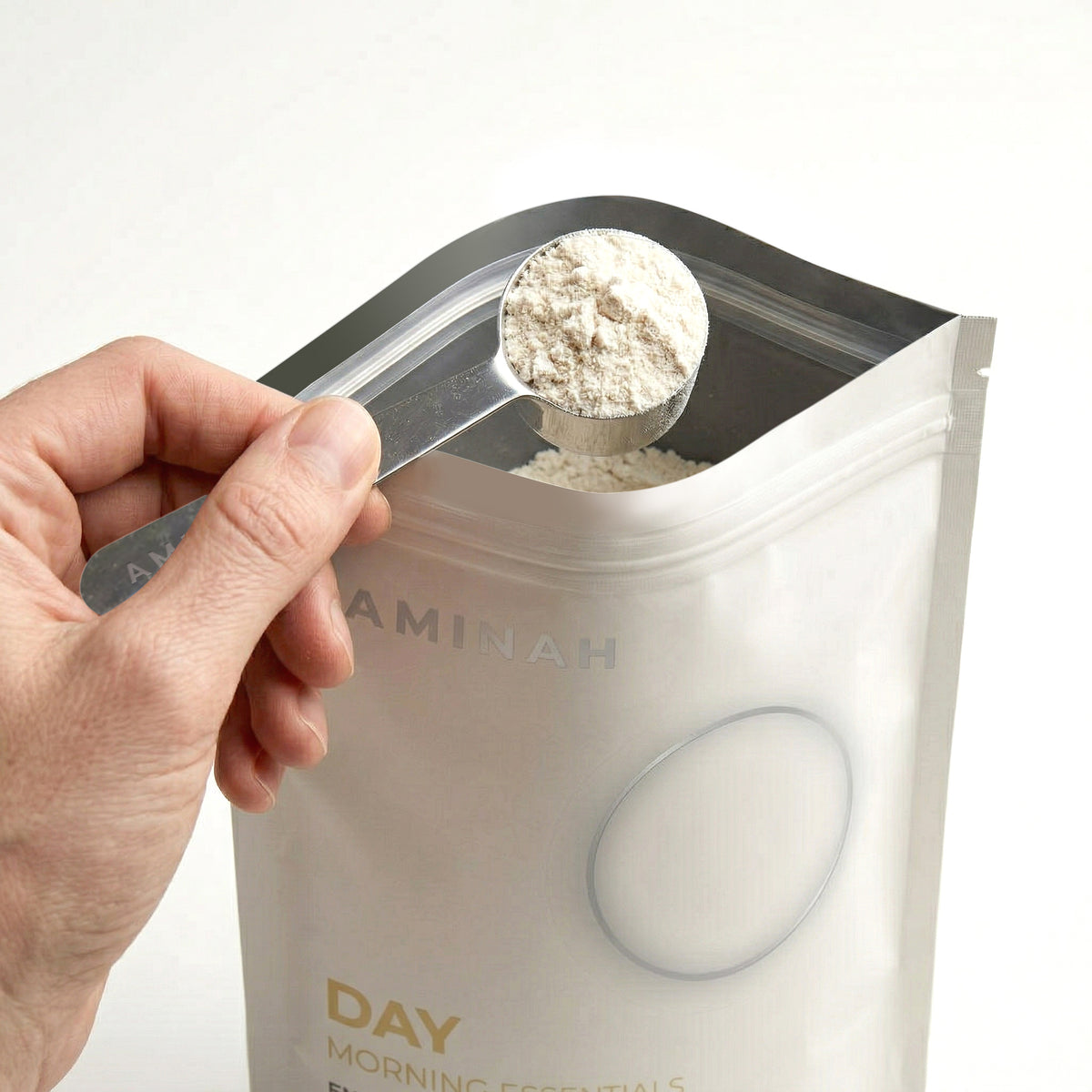AMINAH Day — open jar with scoop showing powder format